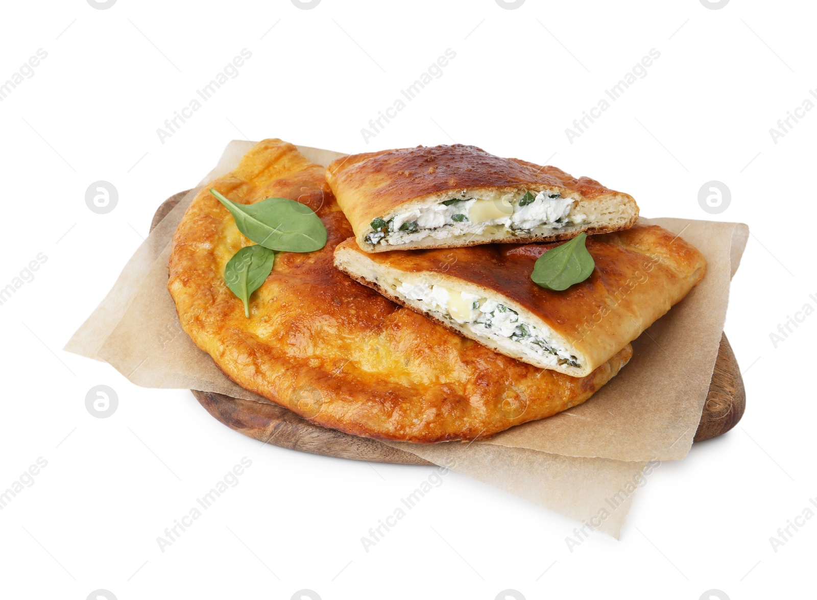 Photo of Tasty calzones with cheese and basil isolated on white