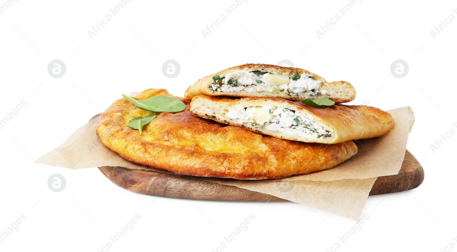 Photo of Tasty calzones with cheese and basil isolated on white