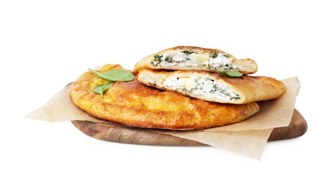 Photo of Tasty calzones with cheese and basil isolated on white