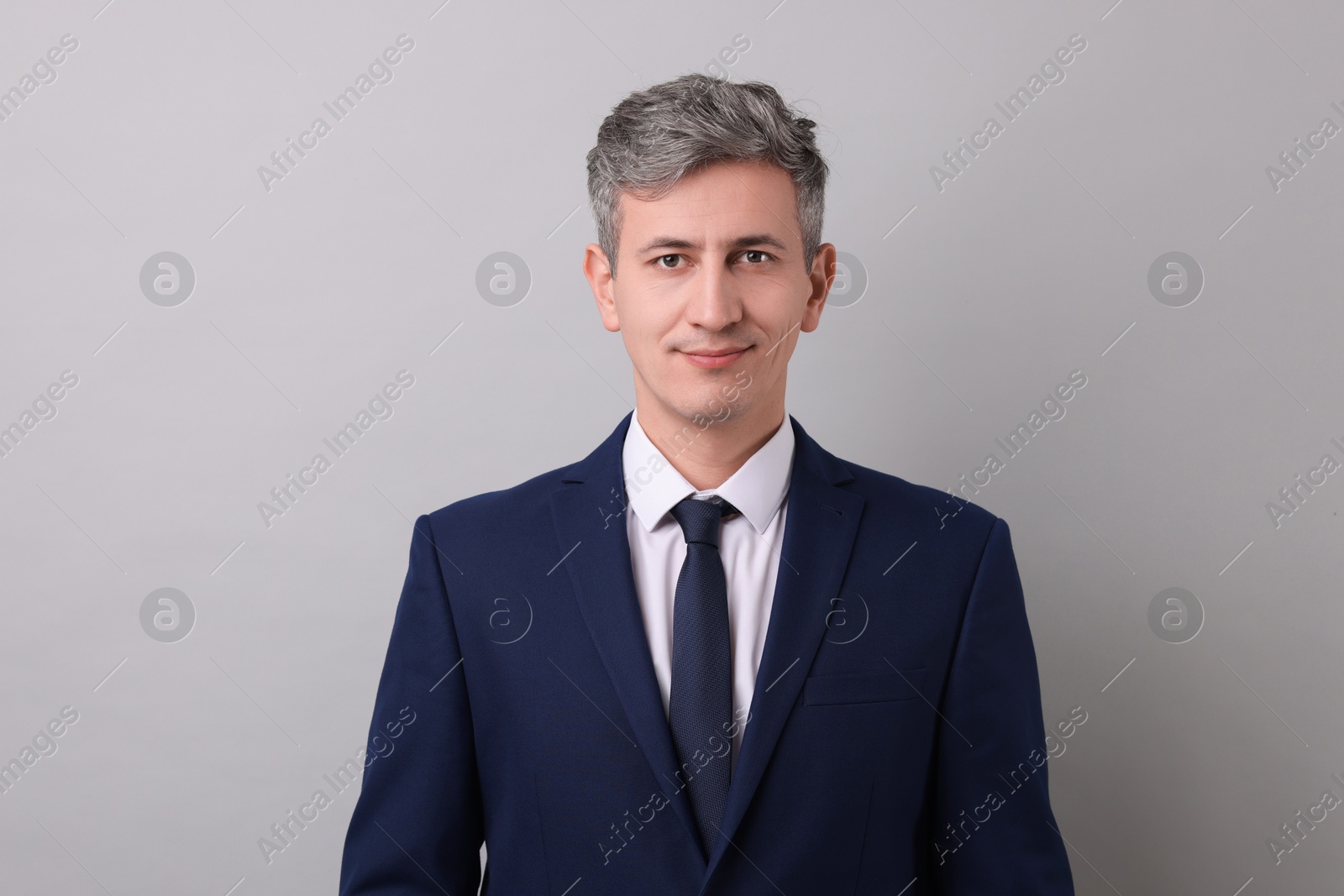 Photo of Portrait of businessman on light grey background