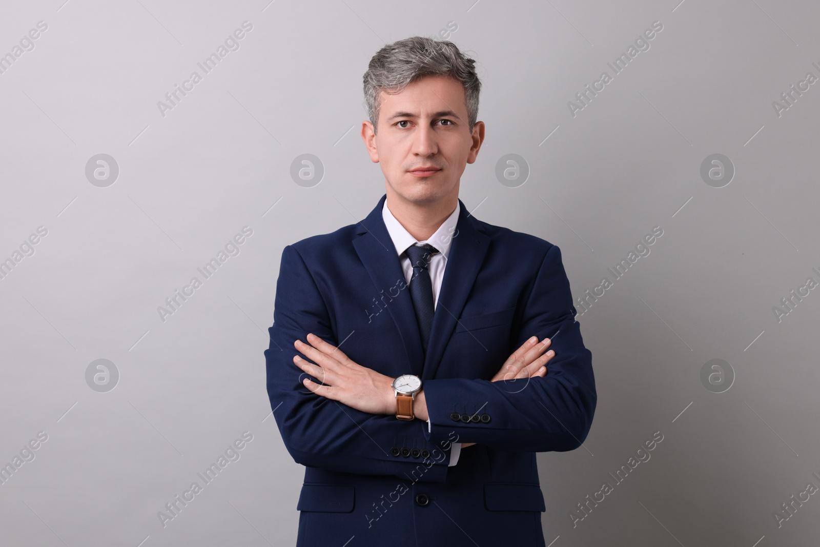 Photo of Portrait of businessman on light grey background