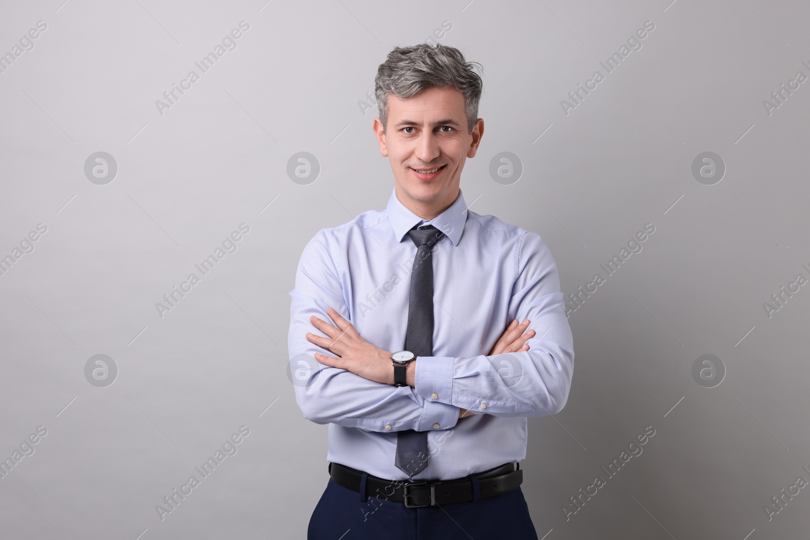 Photo of Portrait of businessman on light grey background