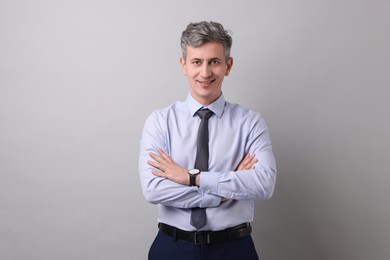 Photo of Portrait of businessman on light grey background