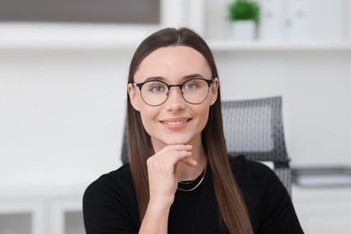 Photo of Portrait of businesswoman in glasses at workplace