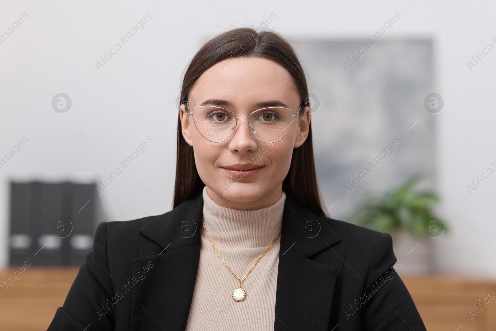 Photo of Portrait of businesswoman in glasses at workplace