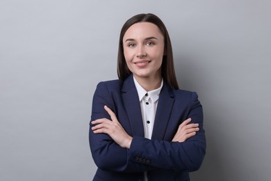 Photo of Portrait of businesswoman on light grey background