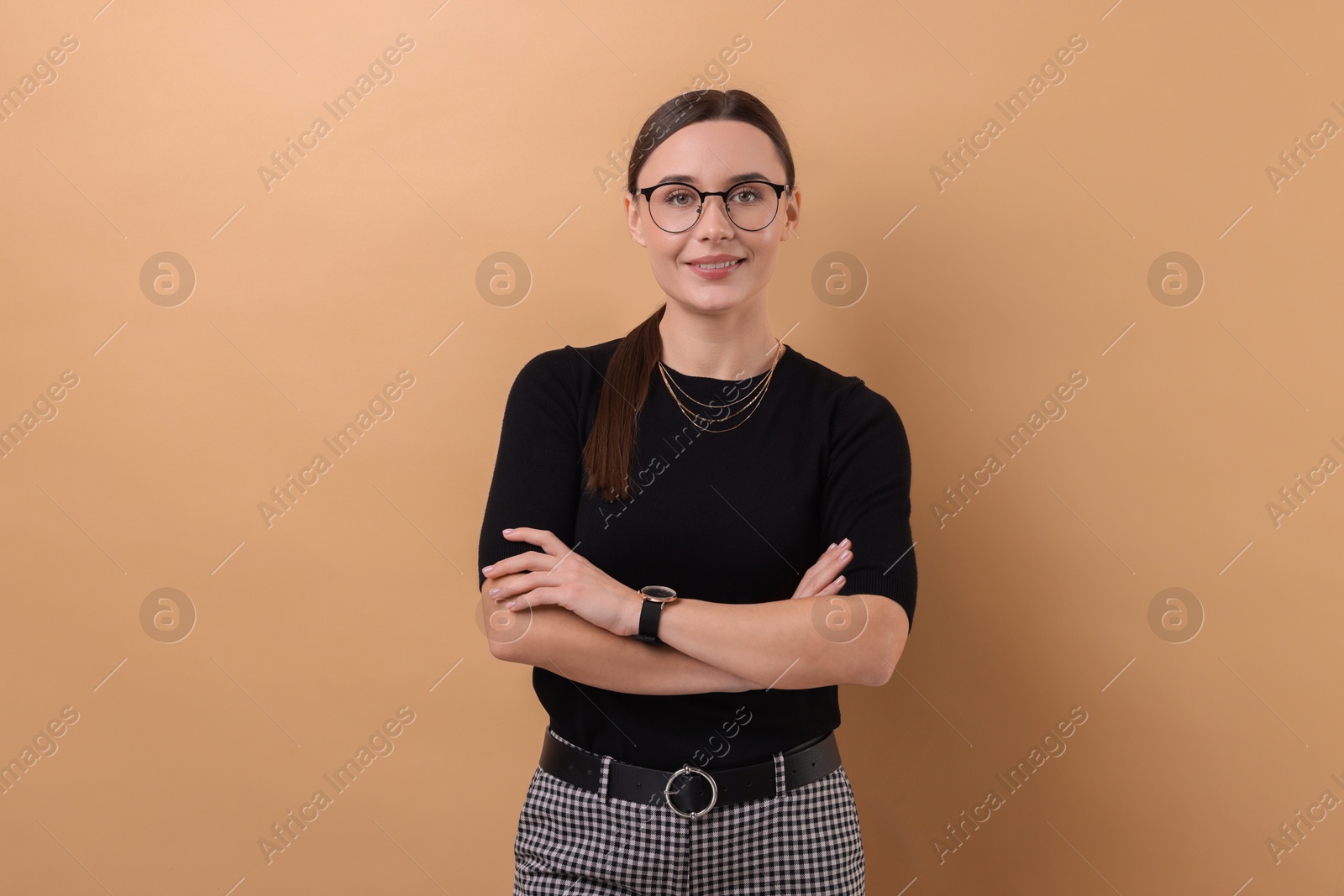 Photo of Portrait of businesswoman in glasses on beige background