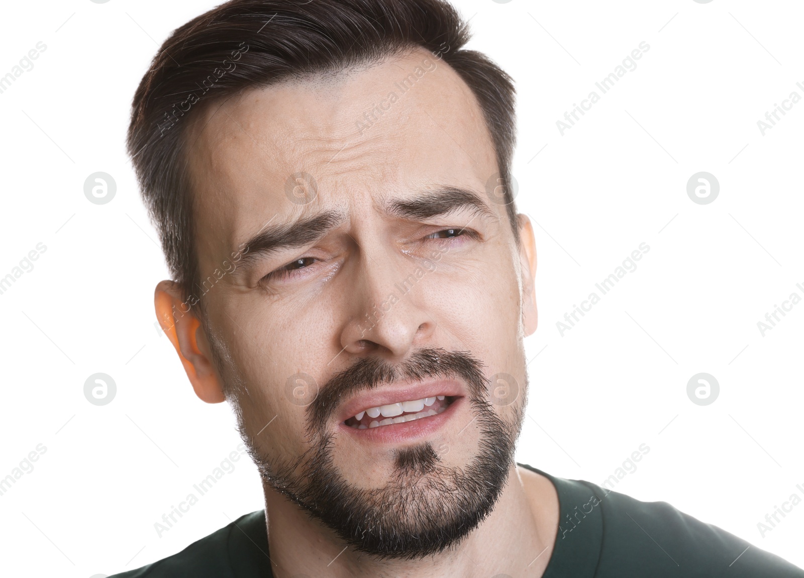 Photo of Portrait of sad man crying on white background