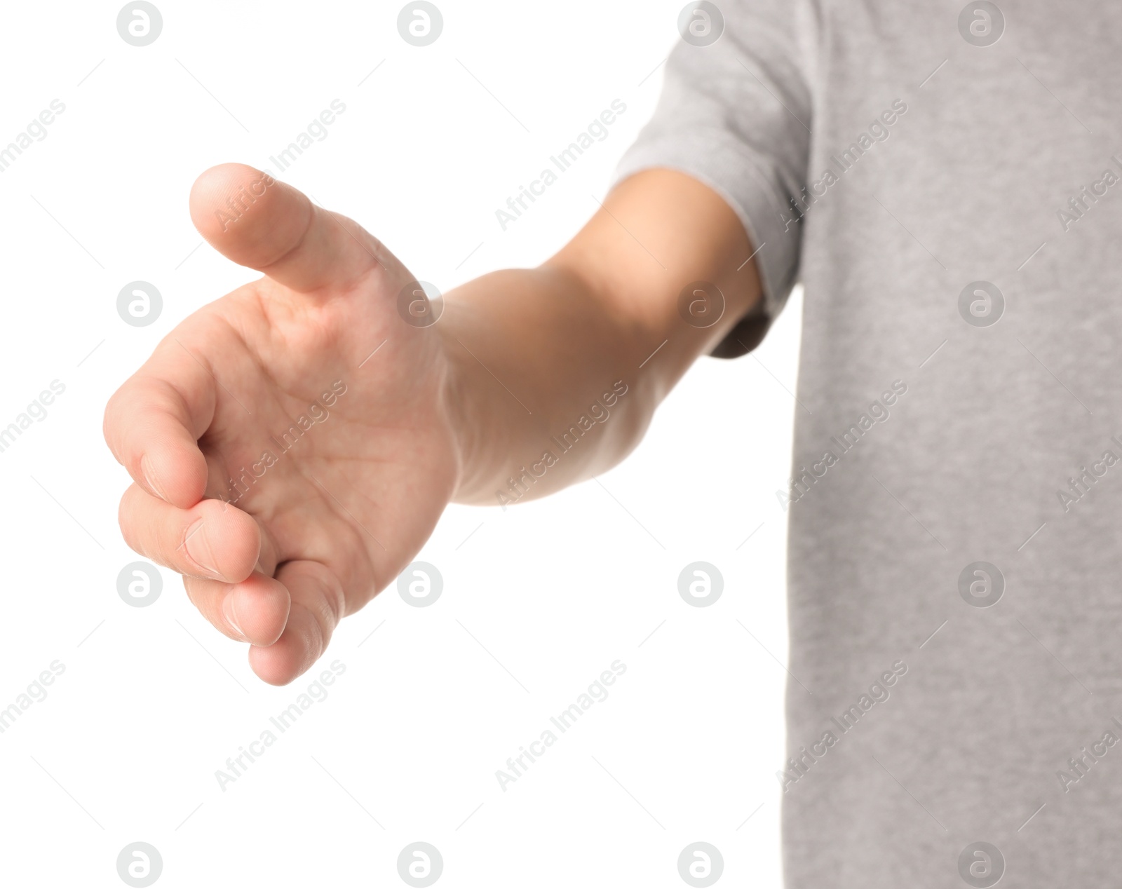 Photo of Offering help. Man reaching his hand on white background, closeup