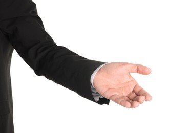 Photo of Offering help. Man reaching his hand on white background, closeup