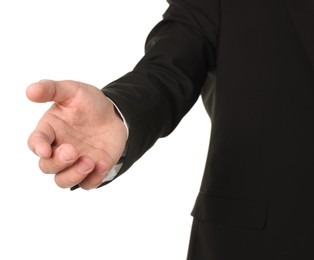 Photo of Offering help. Man reaching his hand on white background, closeup