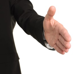 Photo of Offering help. Man reaching his hand on white background, closeup