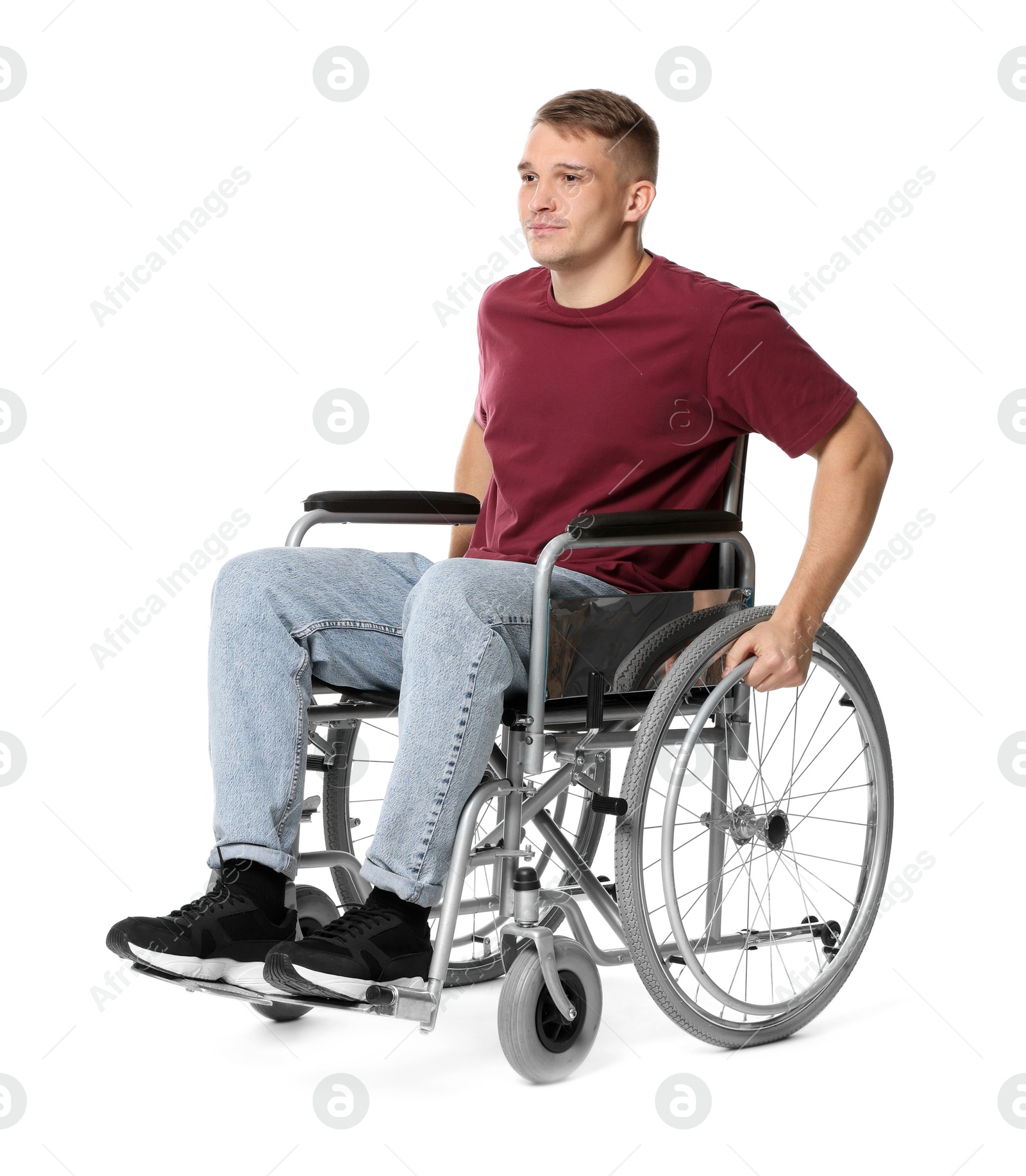 Photo of Young man in wheelchair on white background