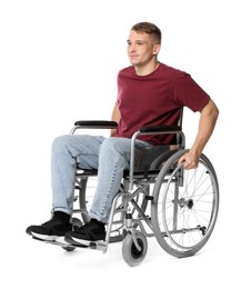 Photo of Young man in wheelchair on white background