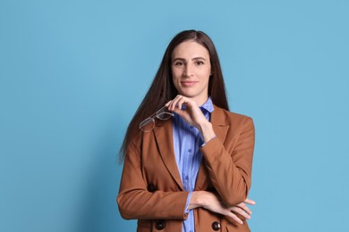 Photo of Banker with glasses on light blue background