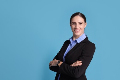 Photo of Portrait of banker on light blue background, space for text