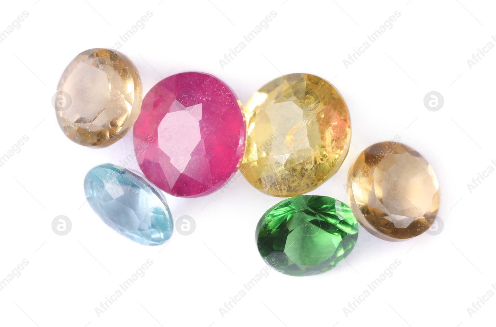 Photo of Different colorful shiny gemstones isolated on white