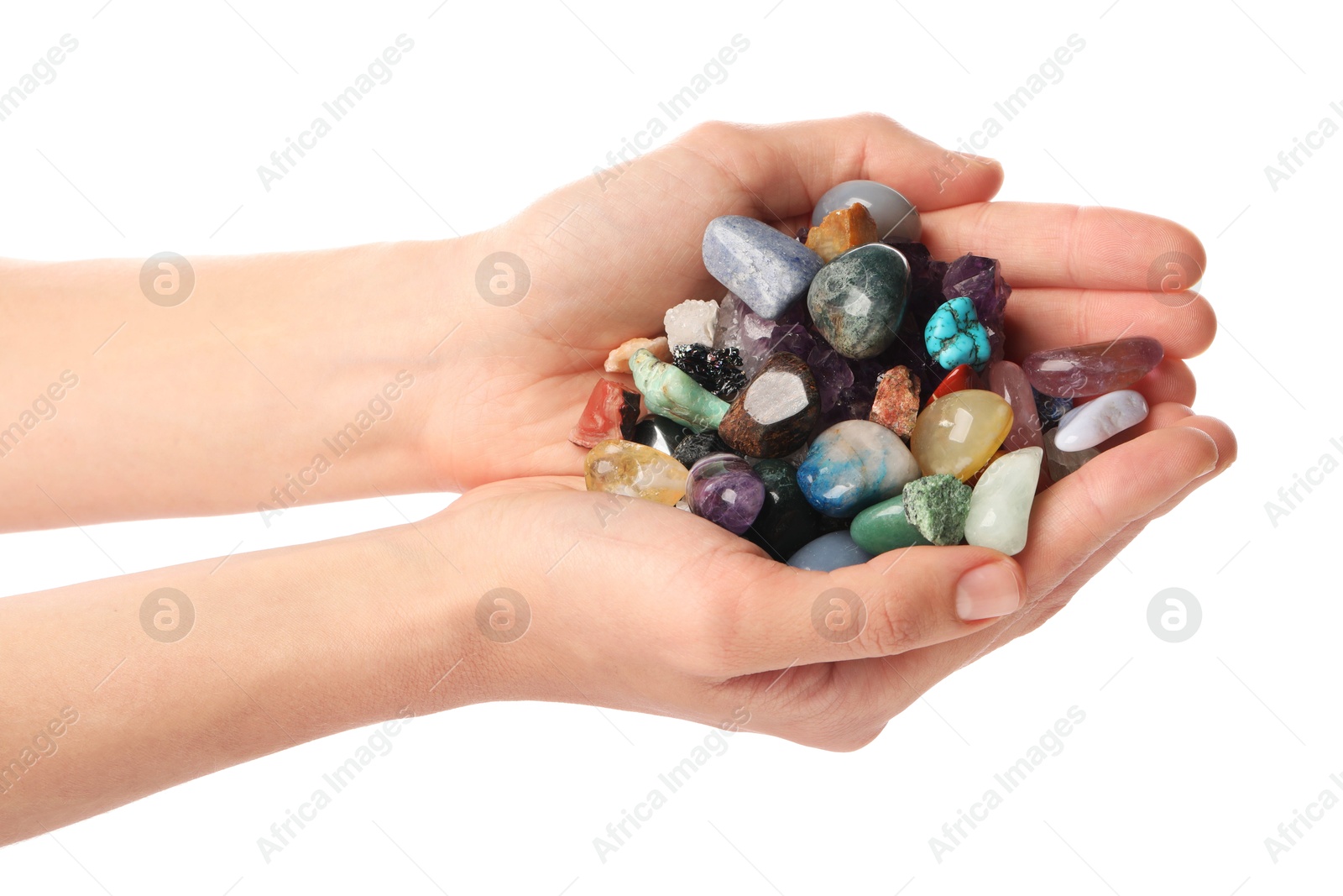 Photo of Woman holding different natural mineral stones on white background, closeup