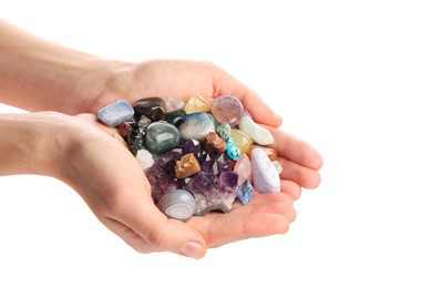 Photo of Woman holding different natural mineral stones on white background, closeup