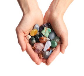 Photo of Woman holding different natural mineral stones on white background, closeup