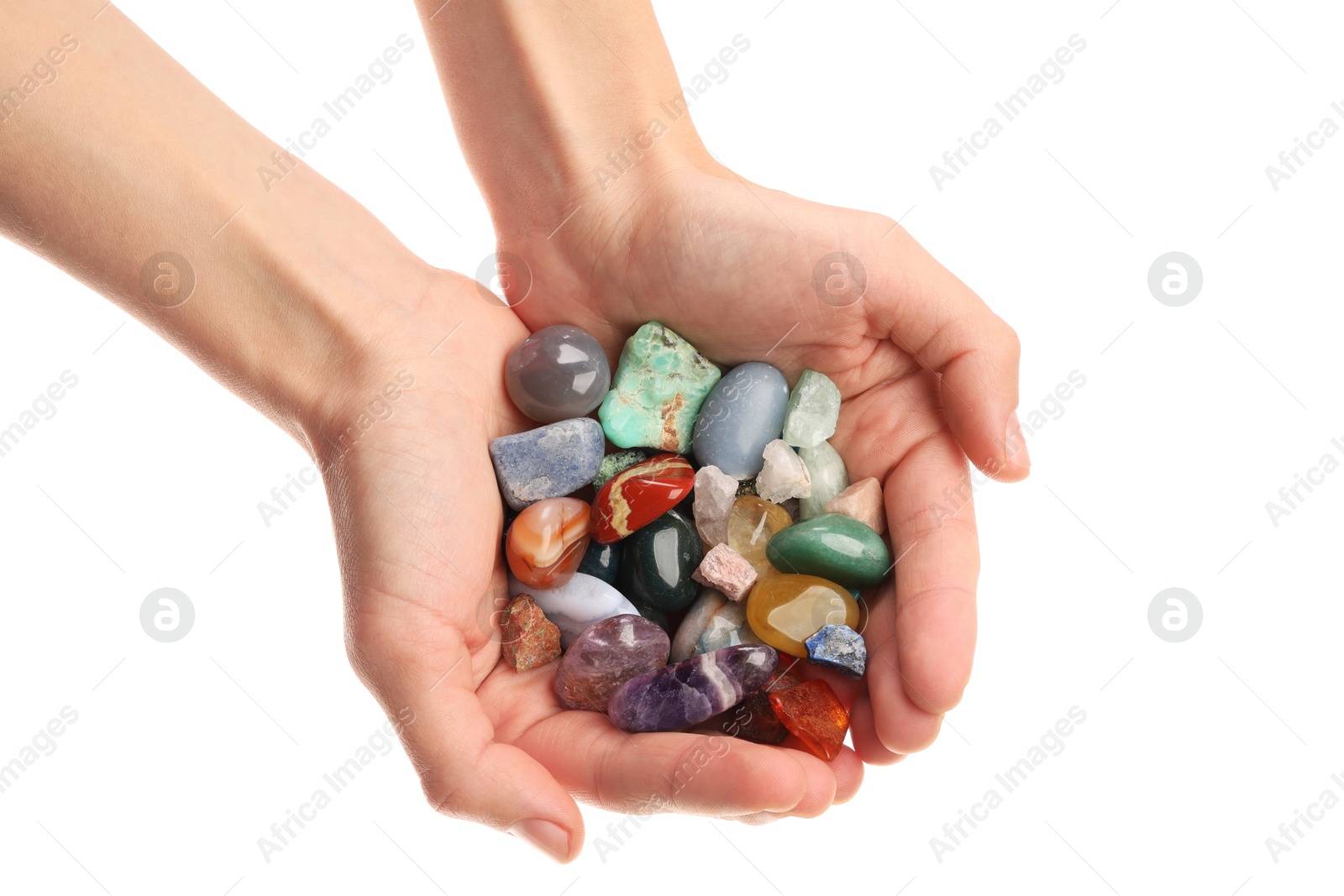 Photo of Woman holding different natural mineral stones on white background, closeup