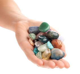 Woman holding different natural mineral stones on white background, closeup