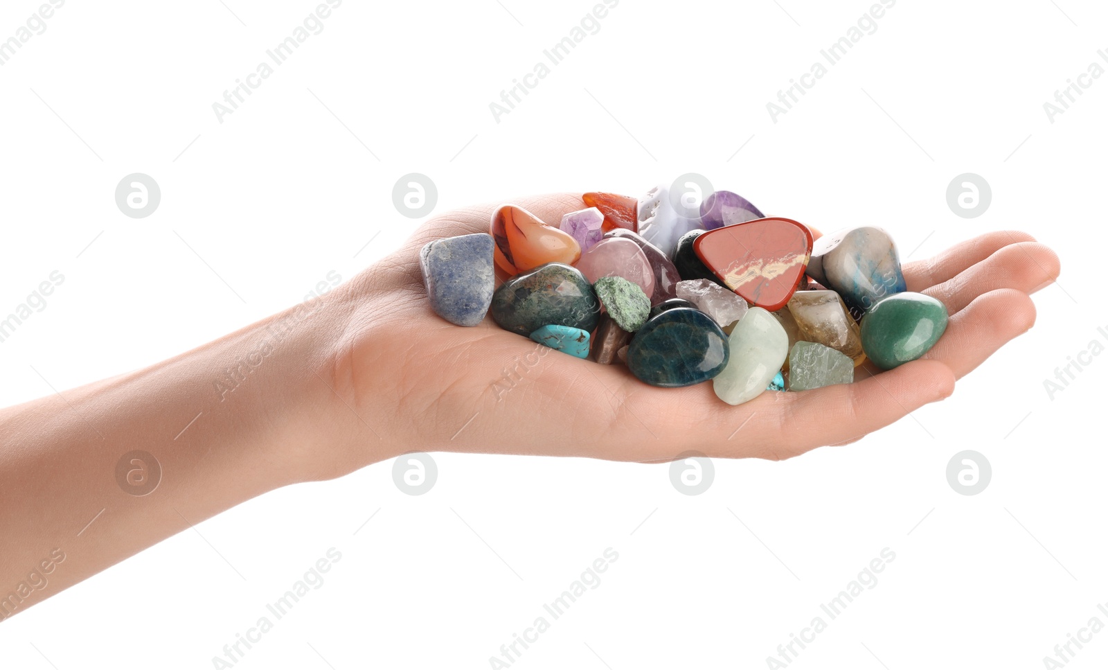 Photo of Woman holding different natural mineral stones on white background, closeup