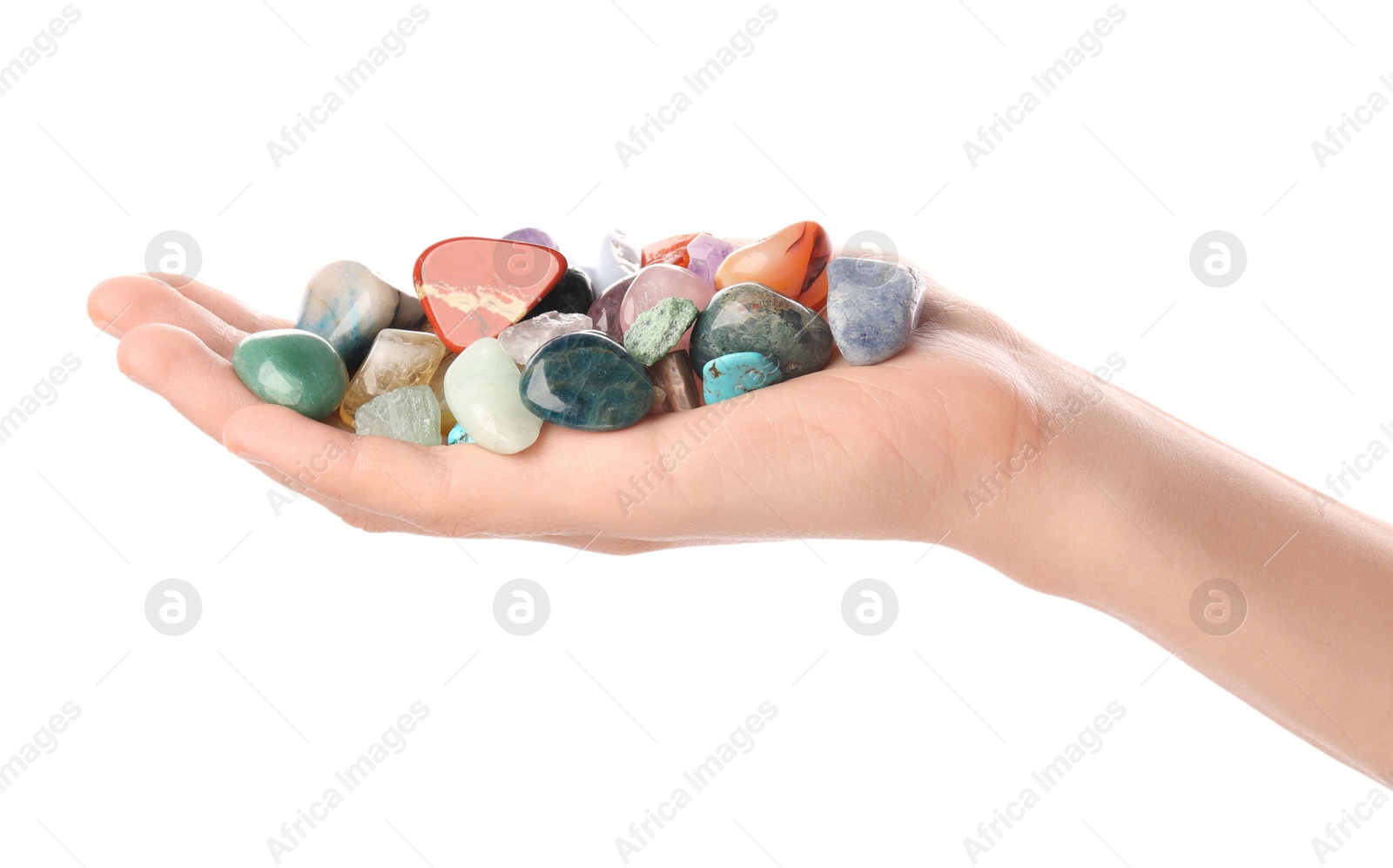 Photo of Woman holding different natural mineral stones on white background, closeup