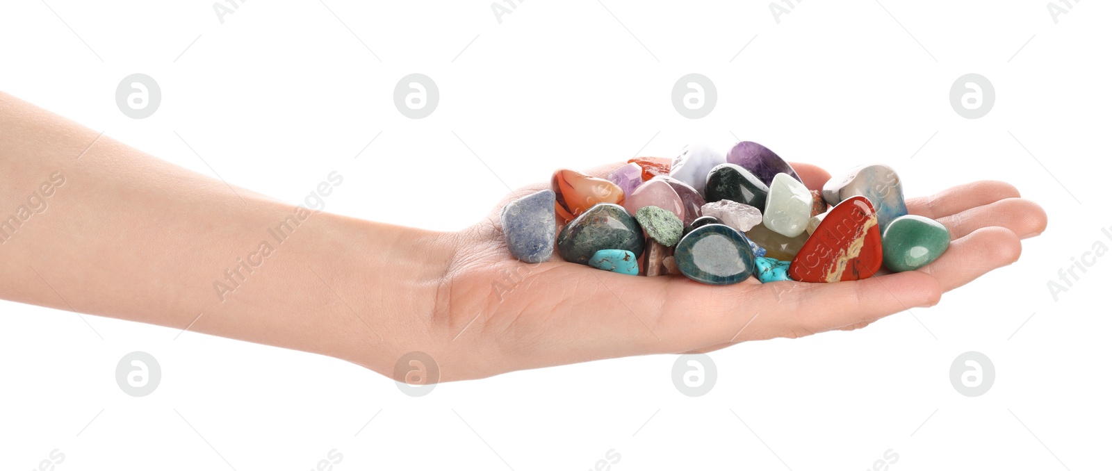 Photo of Woman holding different natural mineral stones on white background, closeup