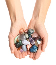 Photo of Woman holding different natural mineral stones on white background, top view