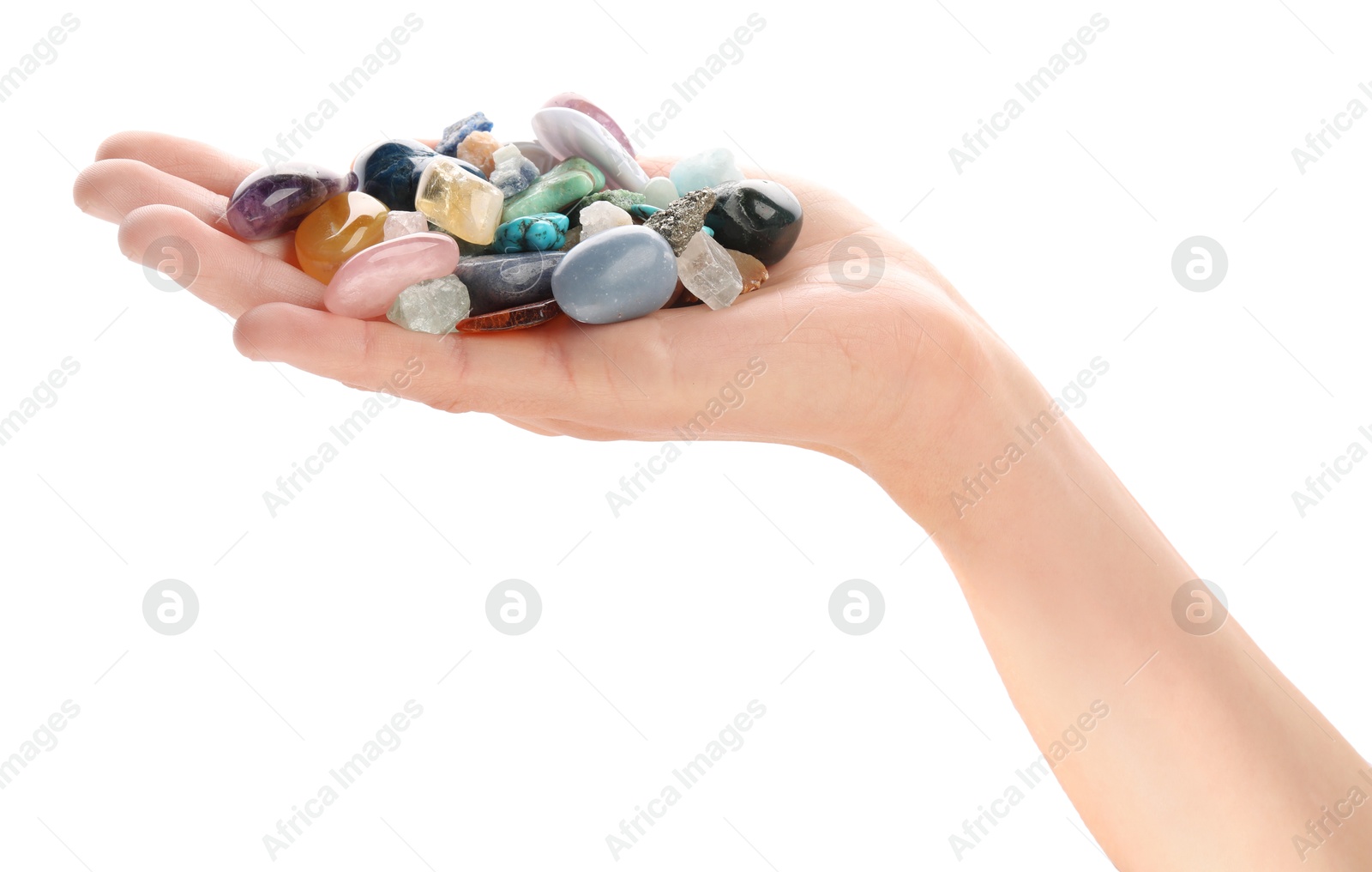 Photo of Woman holding different natural mineral stones on white background, closeup