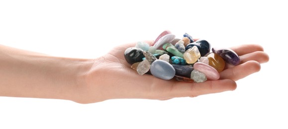 Photo of Woman holding different natural mineral stones on white background, closeup