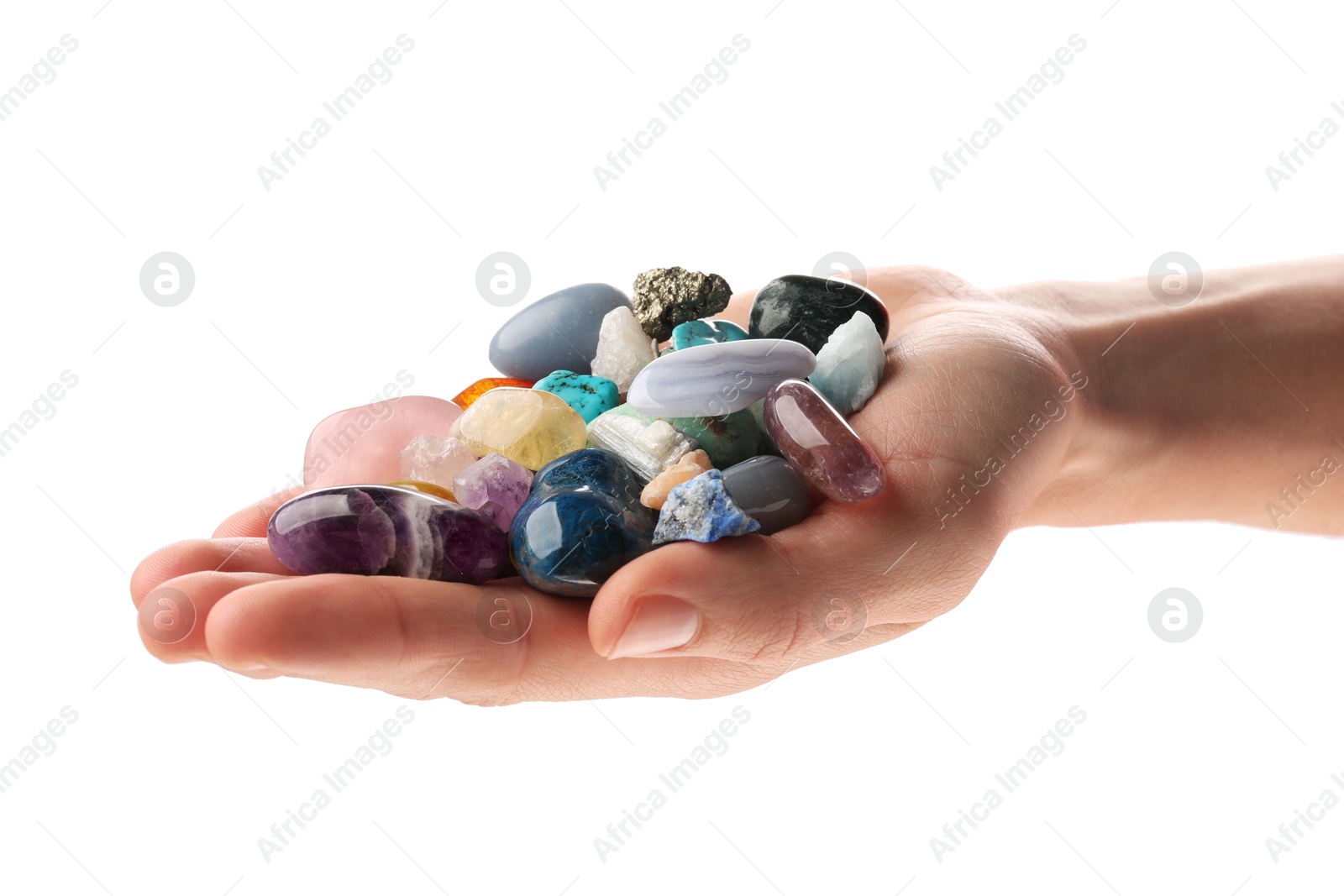 Photo of Woman holding different natural mineral stones on white background, closeup