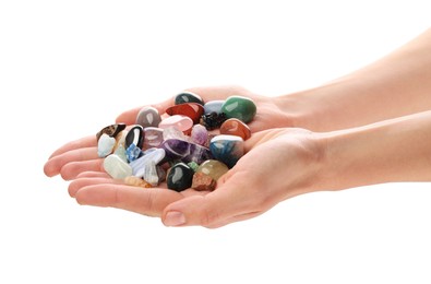 Photo of Woman holding different natural mineral stones on white background, closeup