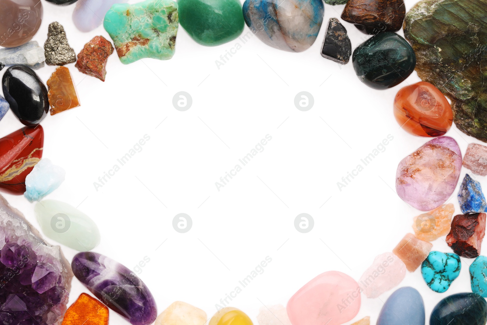 Photo of Frame of different natural mineral stones isolated on white, top view