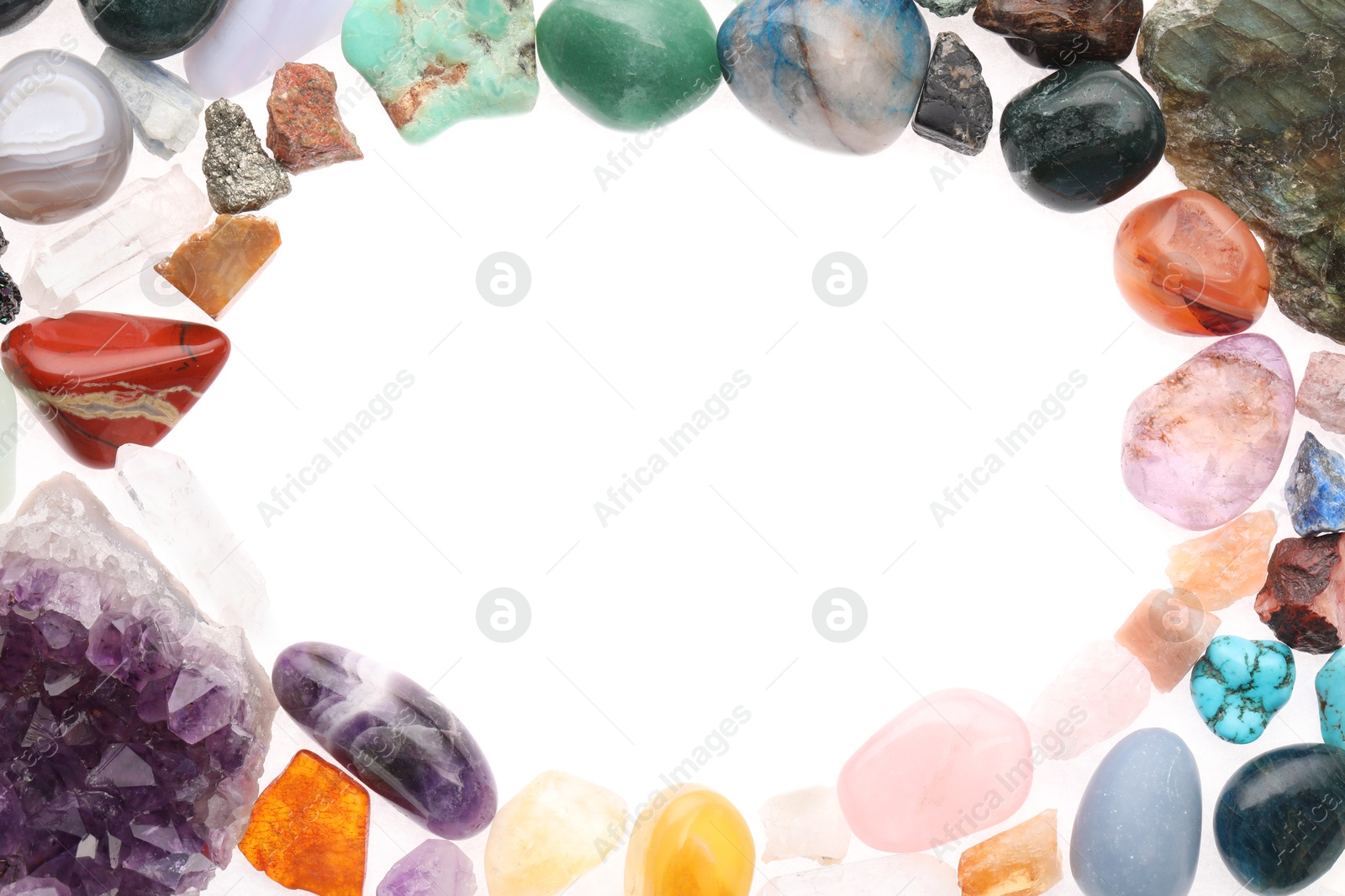 Photo of Frame of different natural mineral stones isolated on white, top view