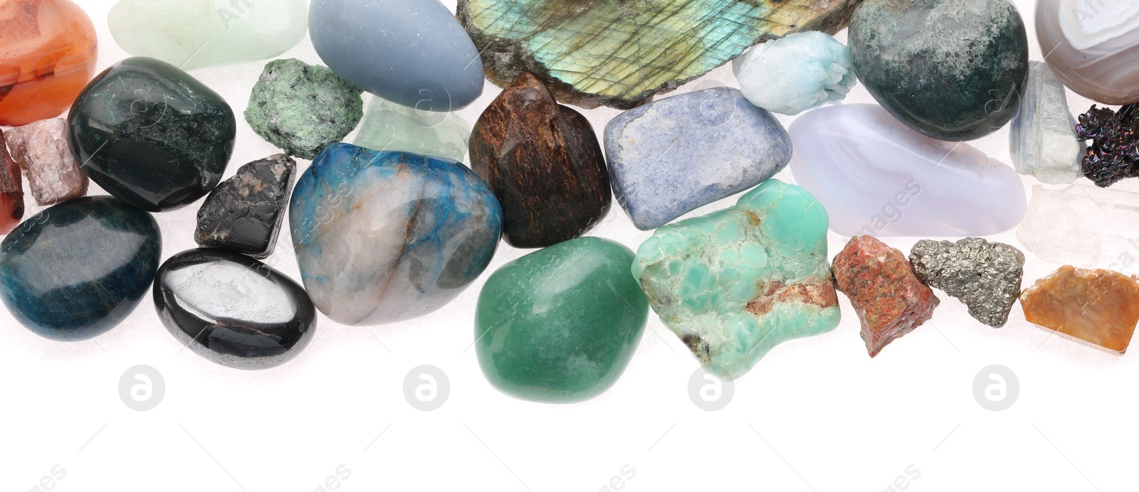 Photo of Different natural mineral stones isolated on white, top view