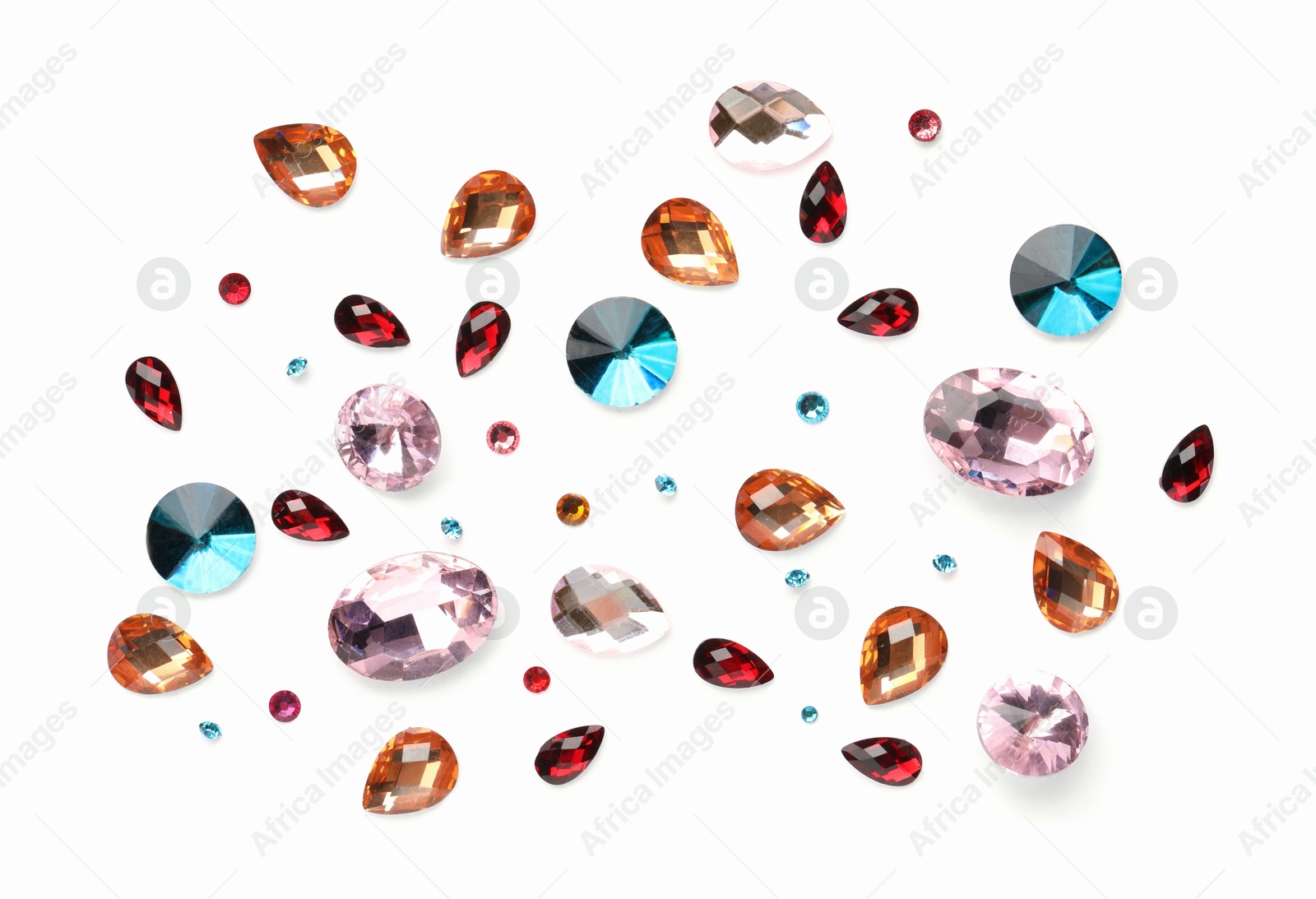 Photo of Different shiny gemstones on white background, flat lay