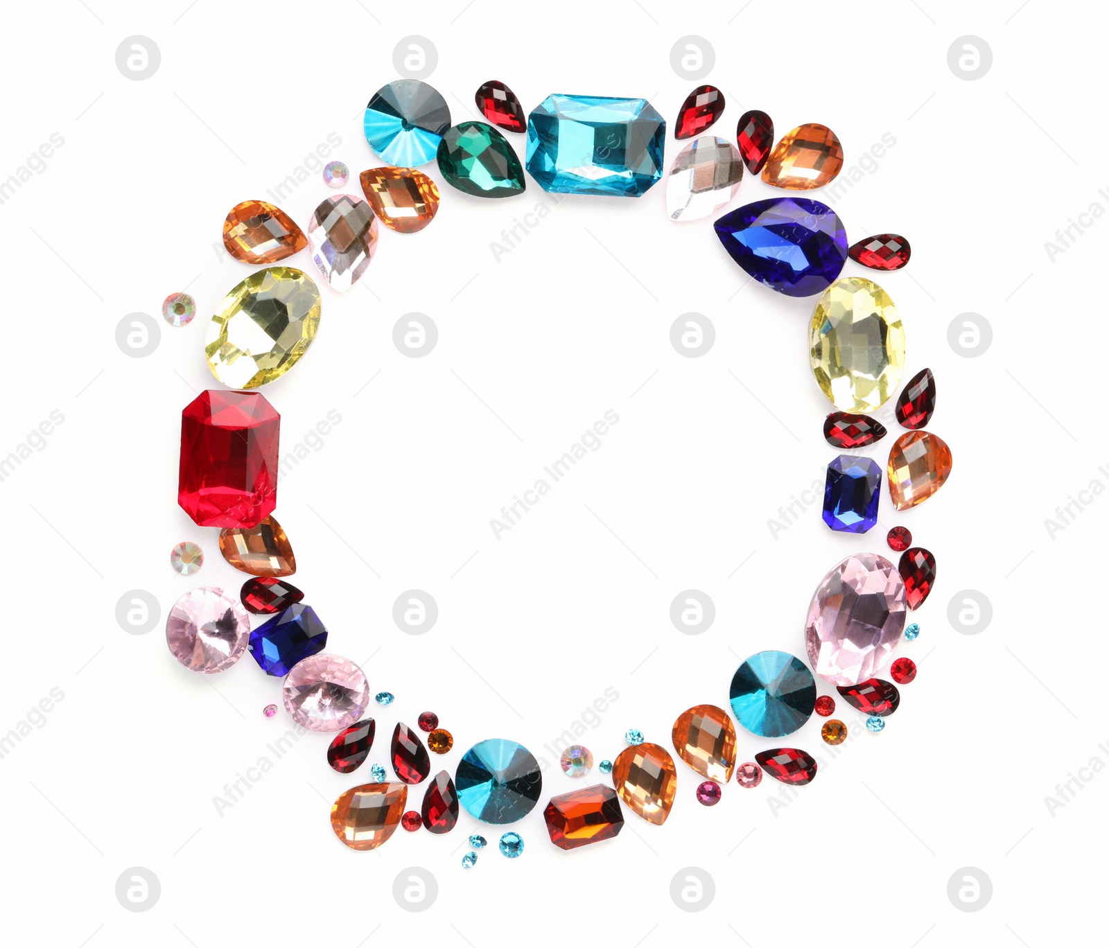 Photo of Frame of different shiny gemstones on white background, flat lay. Space for text