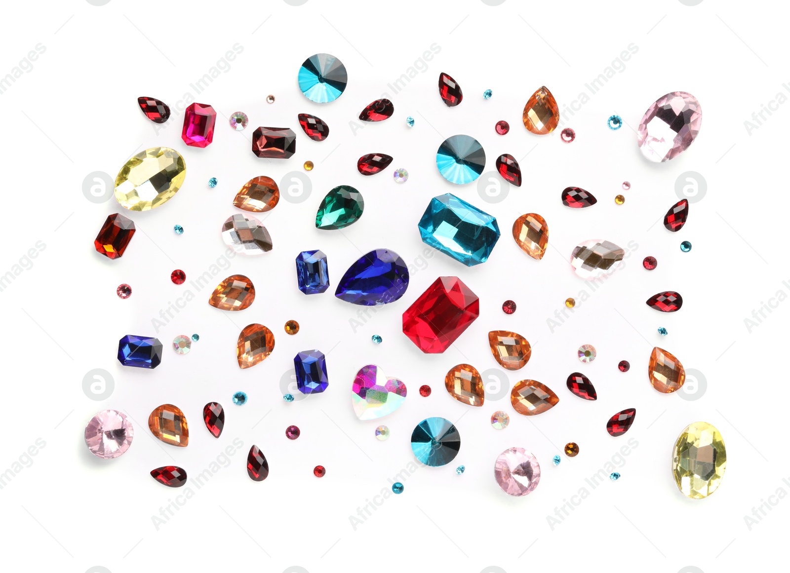 Photo of Different shiny gemstones on white background, flat lay