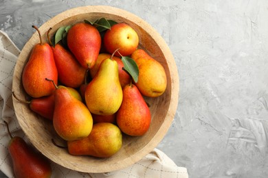 Photo of Ripe juicy pears on grey table, top view