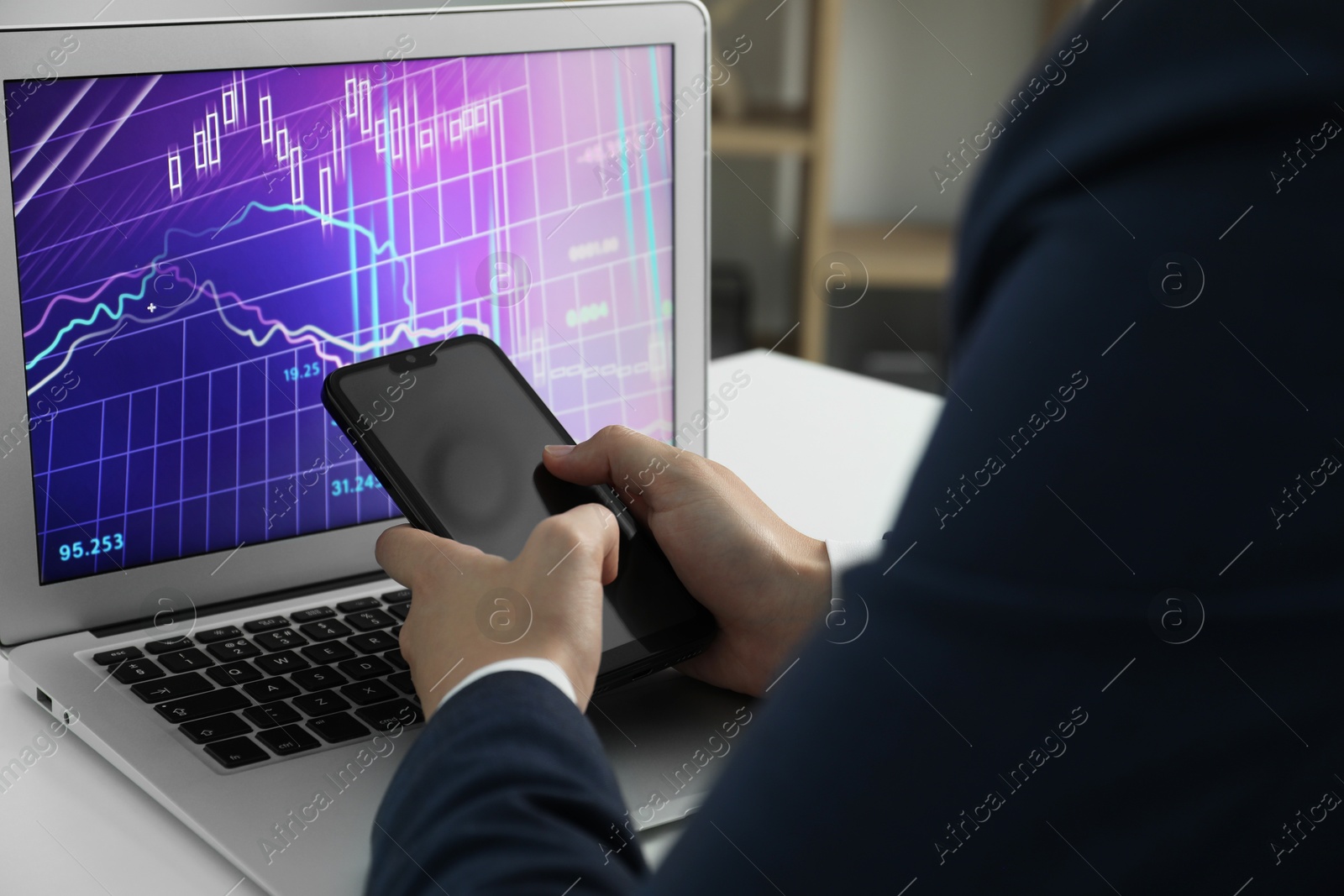 Photo of Businesswoman using smartphone at white table indoors, closeup. Modern technology