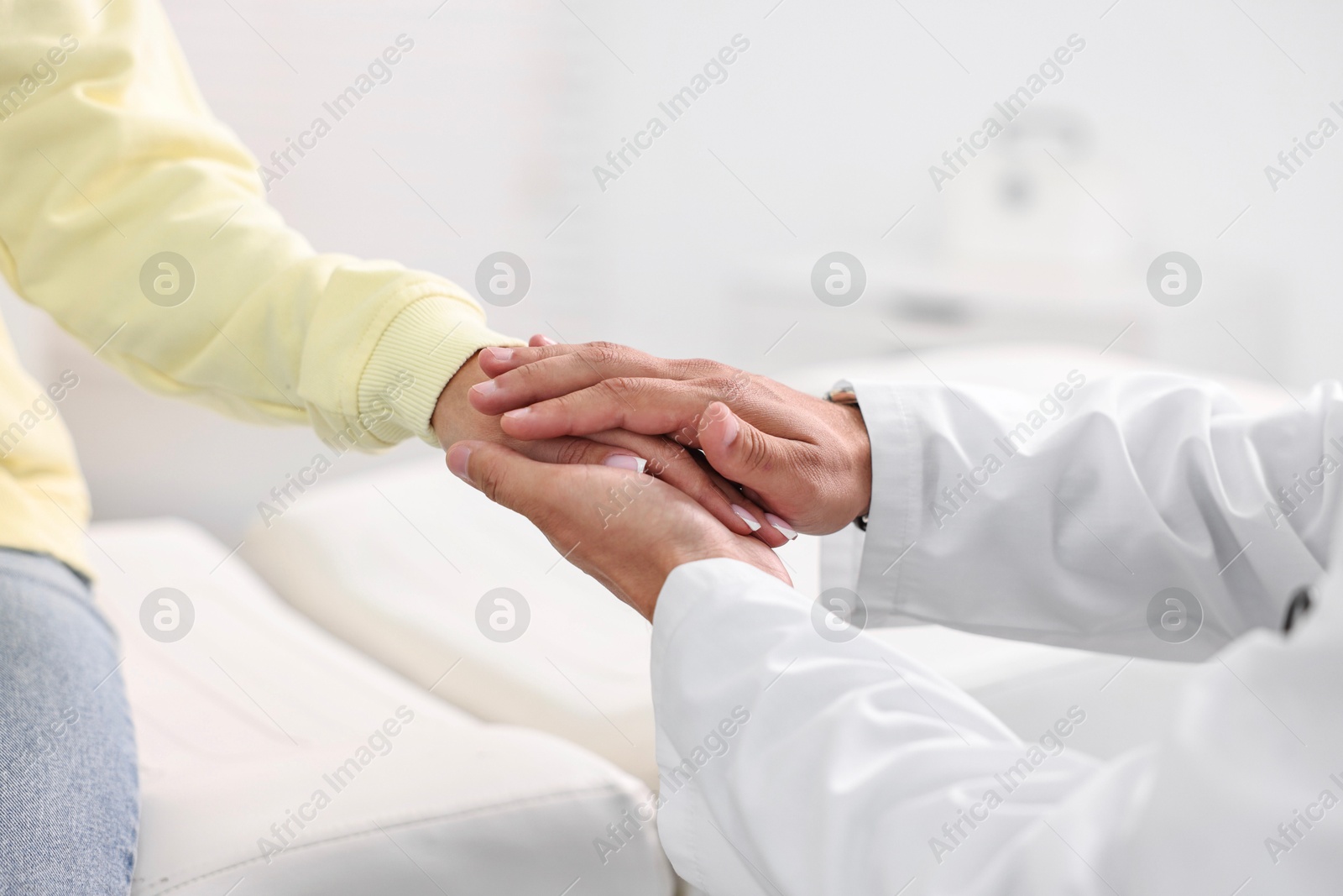 Photo of Healthcare worker supporting patient in hospital, closeup