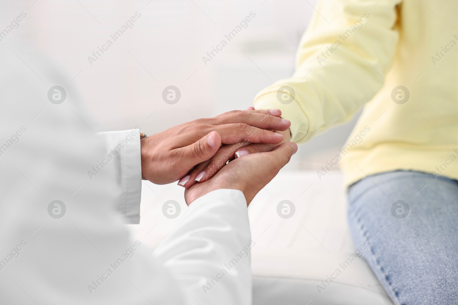 Photo of Healthcare worker supporting patient in hospital, closeup