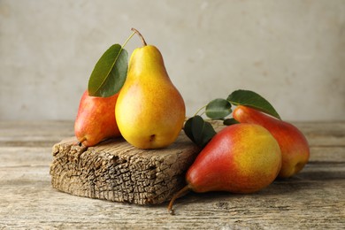 Photo of Many ripe juicy pears on wooden table