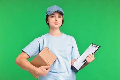 Photo of Girl in uniform with parcel and clipboard on green background. Work for teenagers