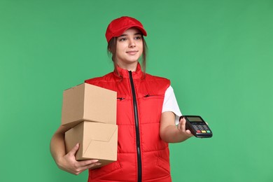 Photo of Girl in uniform with parcels and payment terminal on green background. Work for teenagers