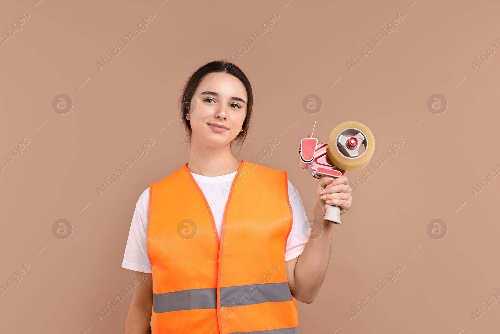 Photo of Girl in uniform with adhesive tape on pale brown background. Work for teenagers