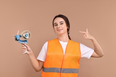 Photo of Girl in uniform with adhesive tape on pale brown background. Work for teenagers