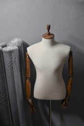 Photo of Many different types of fabric and mannequin in professional workshop